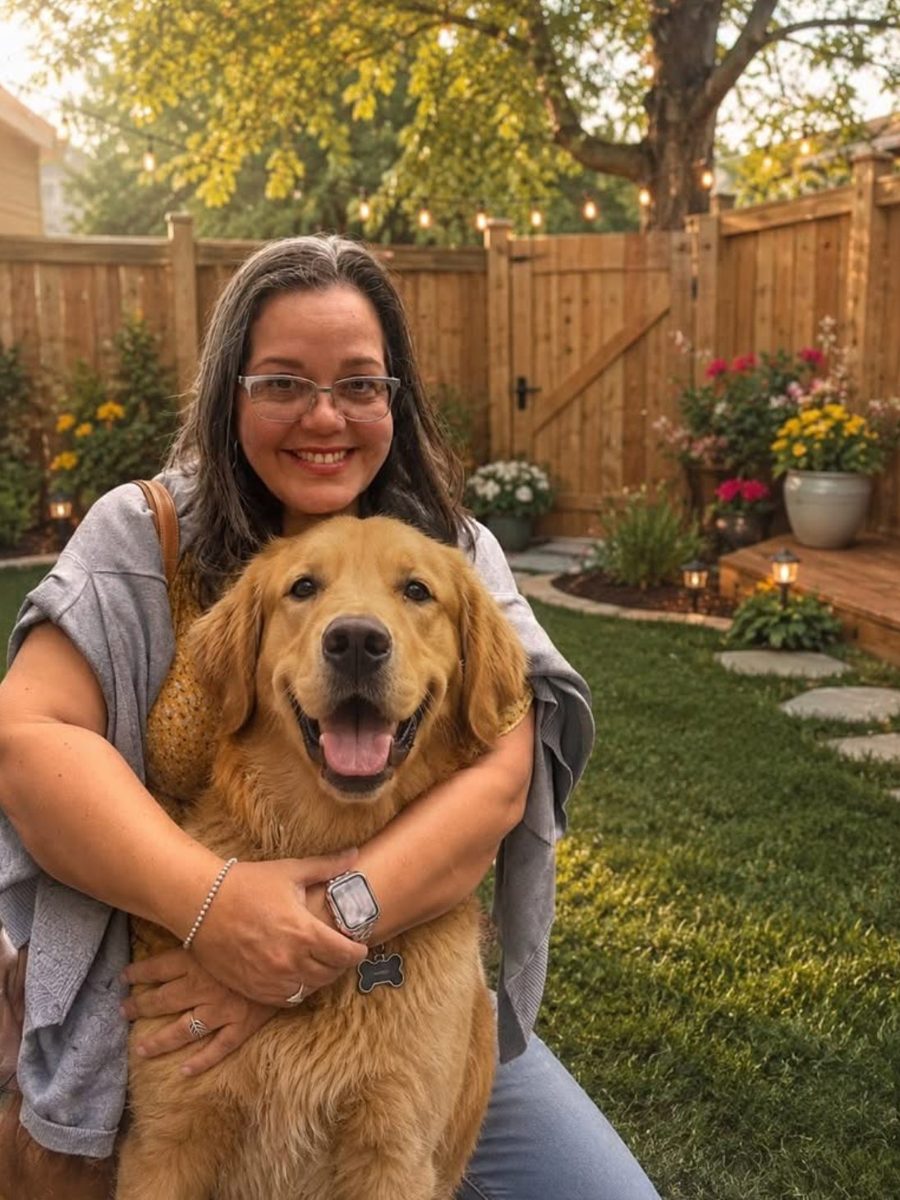 Avranda hugging a golden retriever